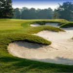 Panoramic view of a lush green golf course at Longshore Golf Course. Smooth