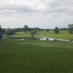 green grass with the flag in the hole.