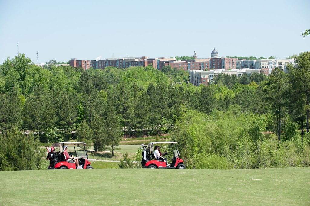 Panoramic view of a lush green golf course at Lonnie Poole Golf Course. Smooth