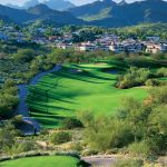 Panoramic view of a lush green golf course at Lookout Mountain Golf Club. Smooth