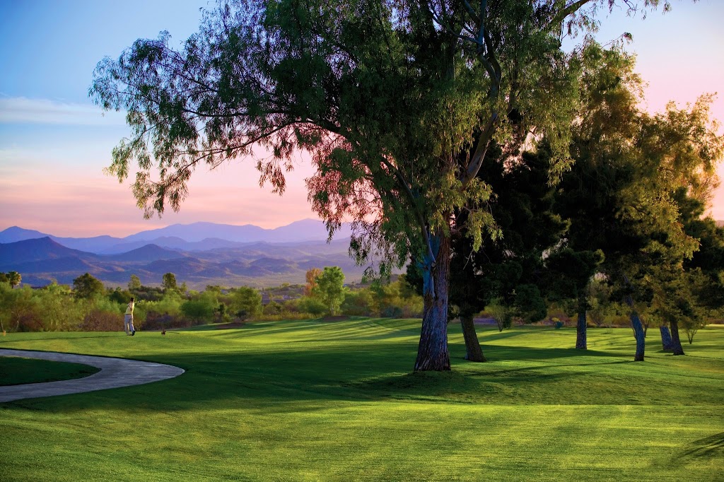 Panoramic view of a lush green golf course at Los Caballeros Golf Club. Smooth