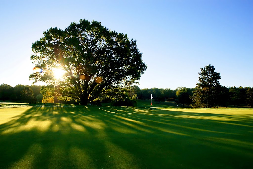 Panoramic view of a lush green golf course at Lost Nation Golf Course. Smooth