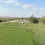 green grass with the flag in the hole.