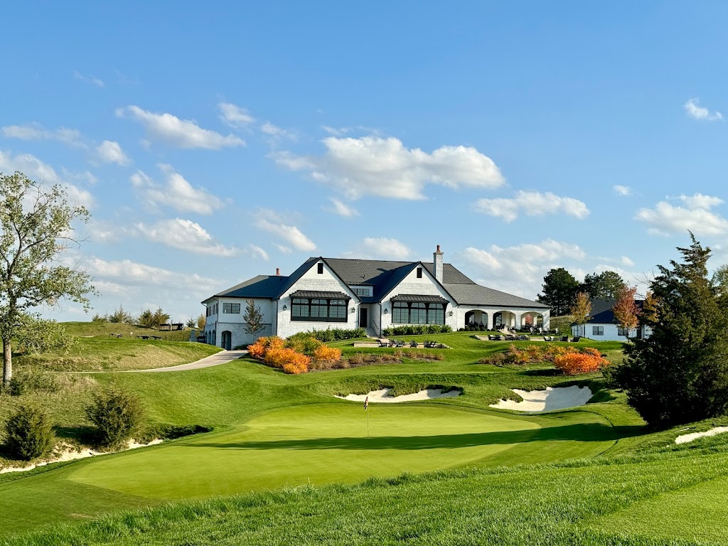 Panoramic view of a lush green golf course at Lost Rail Golf Club. Smooth