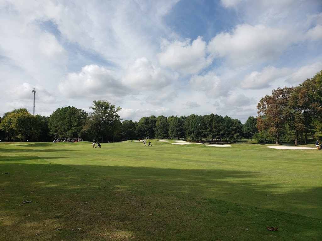 Panoramic view of a lush green golf course at Lost Springs Golf & Athletic Club. Smooth