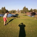 green grass with the flag in the hole.