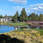 Panoramic view of a lush green golf course at Lost Tracks Golf Club. Smooth
