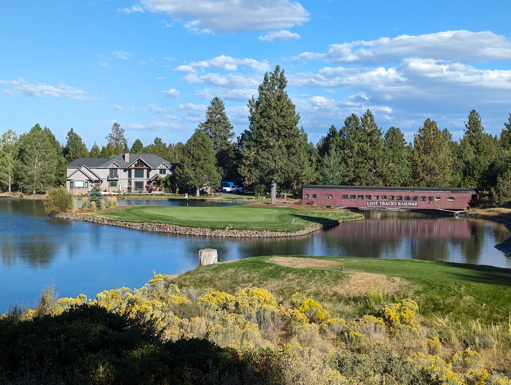 Panoramic view of a lush green golf course at Lost Tracks Golf Club. Smooth
