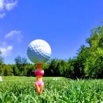 green grass with the flag in the hole.