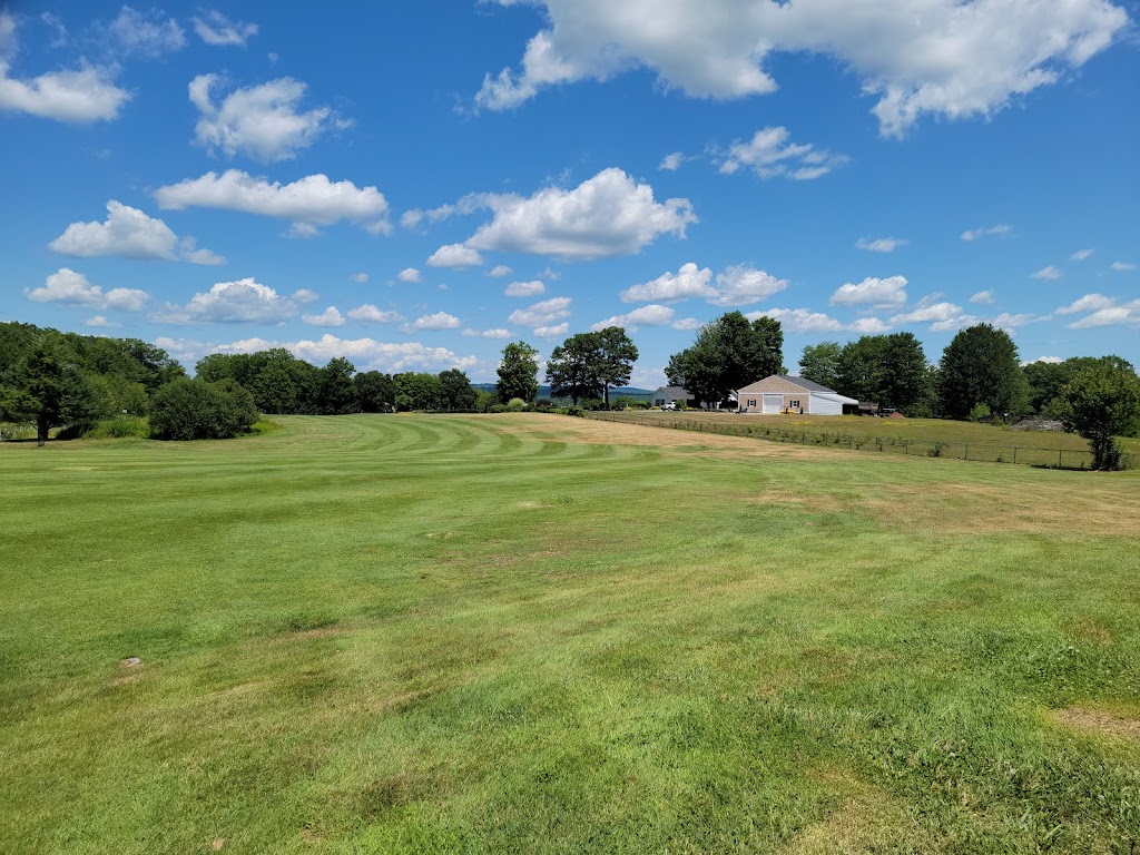 Panoramic view of a lush green golf course at Loudon Country Club. Smooth