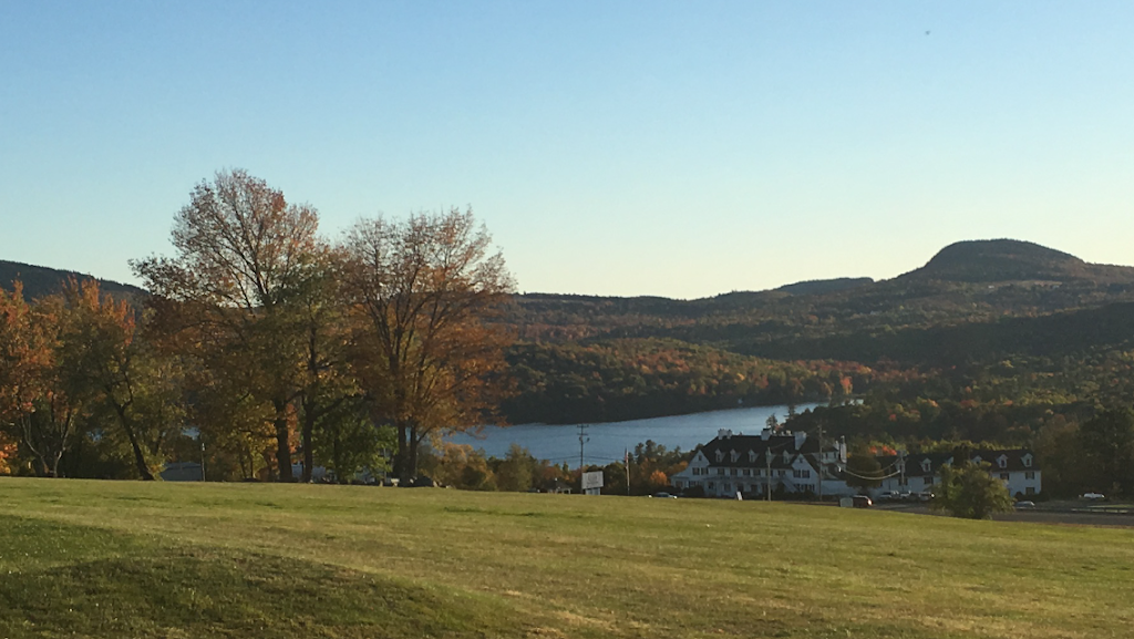 Panoramic view of a lush green golf course at Lucerne Golf Course. Smooth