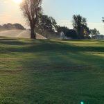 Panoramic view of a lush green golf course at Lyons Public Golf Course. Smooth