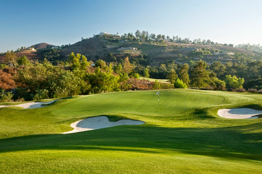 Panoramic view of a lush green golf course at Maderas Golf Club. Smooth