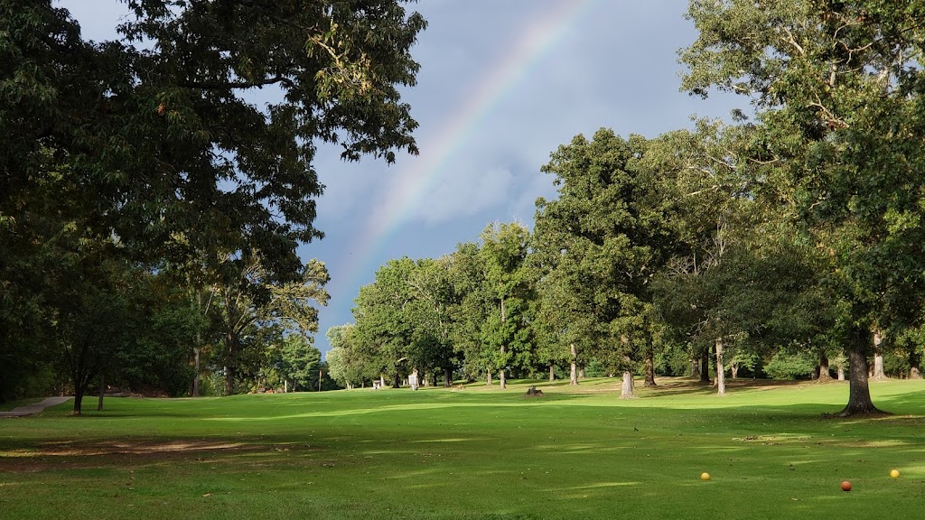 Panoramic view of a lush green golf course at Madisonville Golf course. Smooth