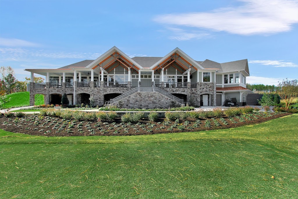 Panoramic view of a lush green golf course at Magnolia Green Golf Club. Smooth