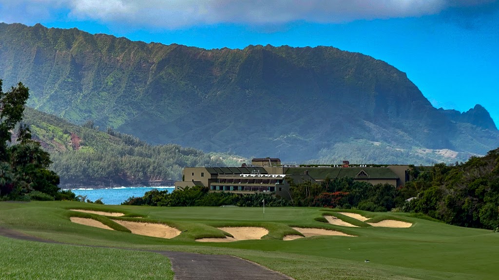 Panoramic view of a lush green golf course at Makai Golf Course. Smooth