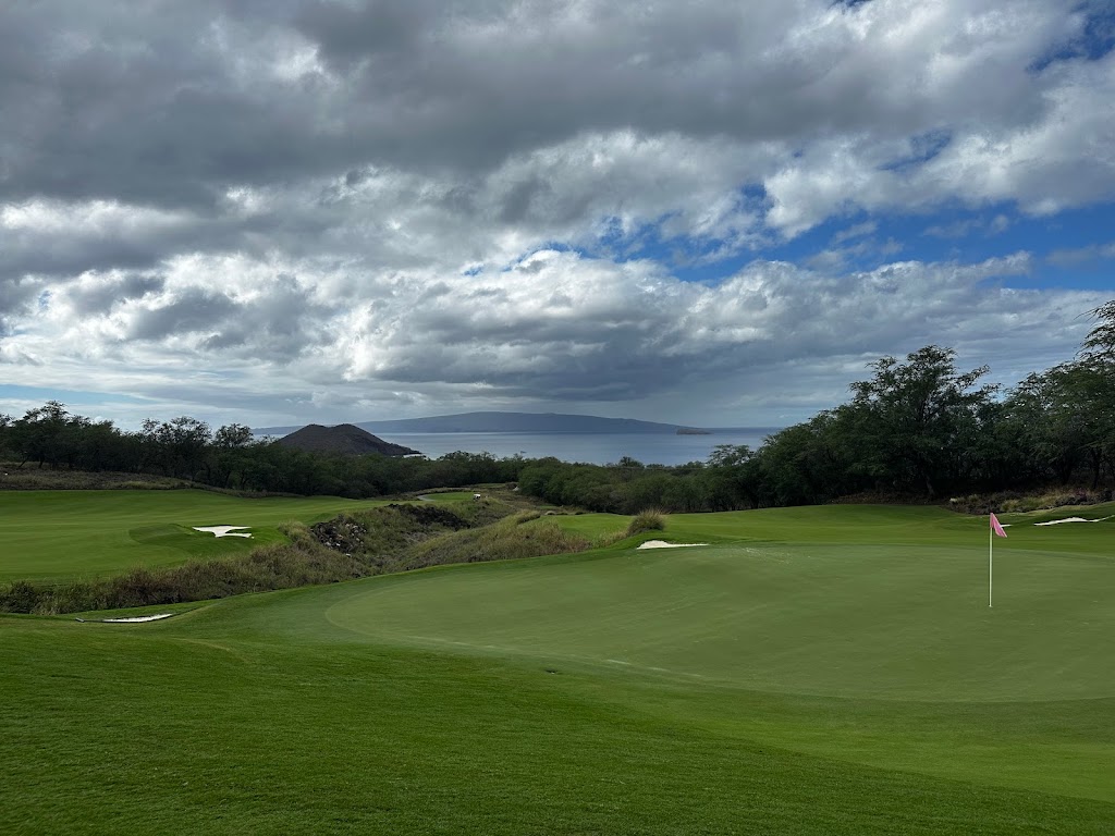 Panoramic view of a lush green golf course at Makena Golf & Beach Club. Smooth