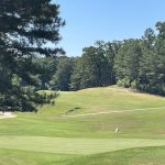Panoramic view of a lush green golf course at Mallard Pointe Golf Course and Villas. Smooth