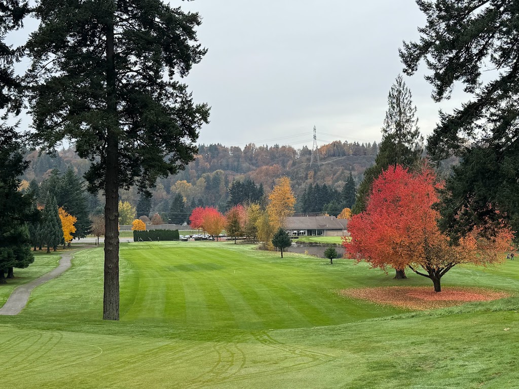 Panoramic view of a lush green golf course at Maplewood Golf Course. Smooth