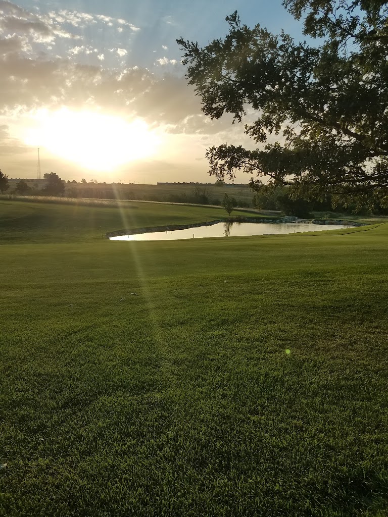 Panoramic view of a lush green golf course at Mariah Hills Golf Course Maintenance. Smooth