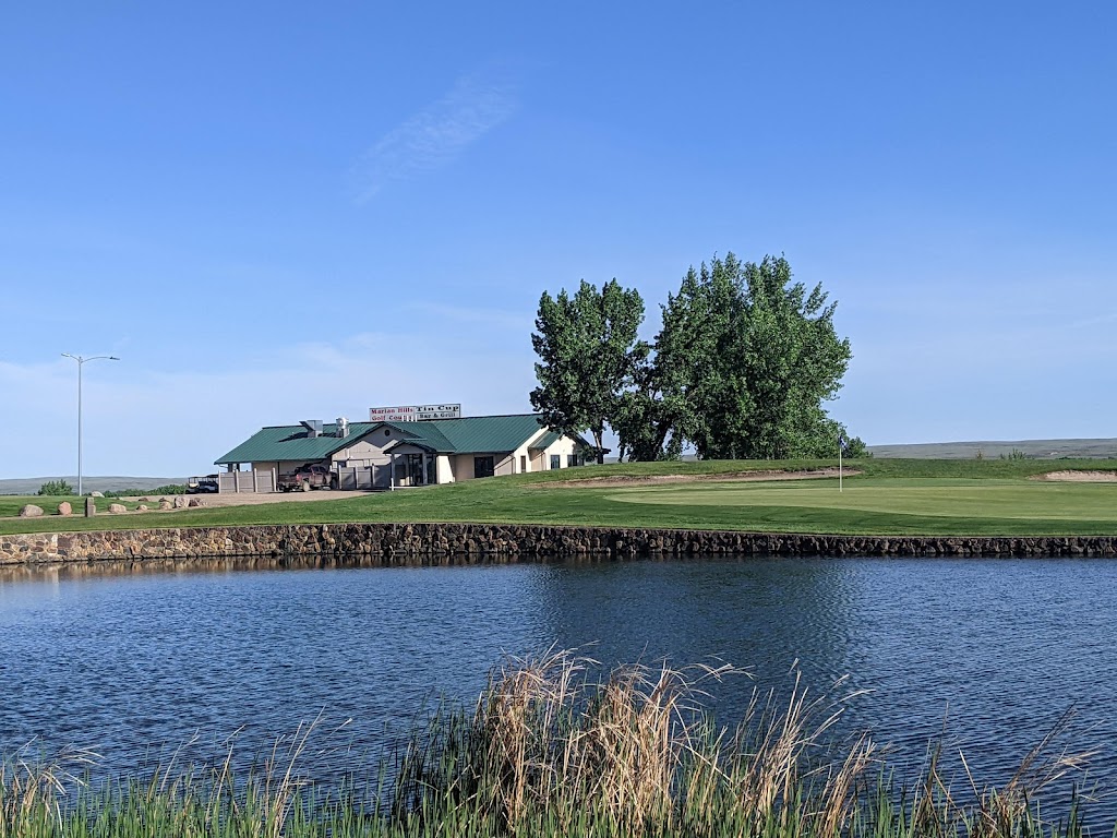 Panoramic view of a lush green golf course at Marian Hills Golf Course. Smooth