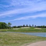 Panoramic view of a lush green golf course at Marion Golf Course. Smooth