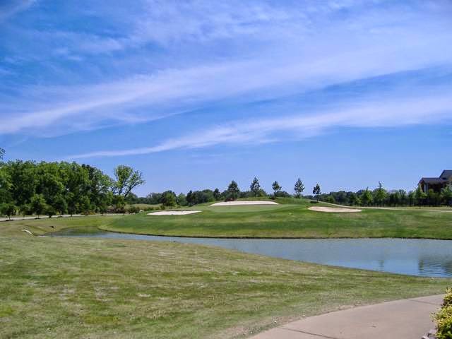Panoramic view of a lush green golf course at Marion Golf Course. Smooth
