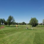 Panoramic view of a lush green golf course at Marker 40 Golf Club. Smooth