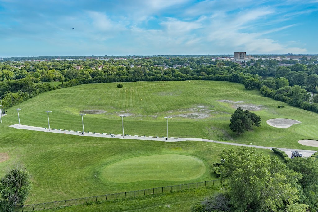 Panoramic view of a lush green golf course at Marquette Park Golf Course. Smooth