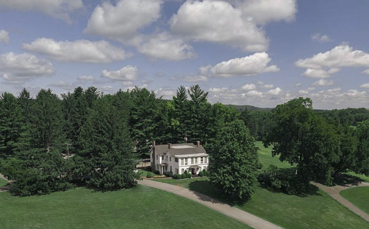 Panoramic view of a lush green golf course at Martinsville Golf Club. Smooth