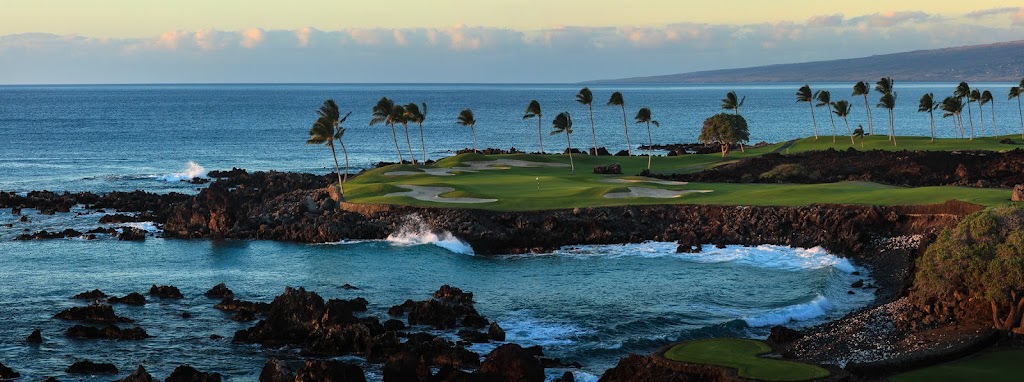 Panoramic view of a lush green golf course at Mauna Lani Golf. Smooth
