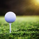 green grass with the flag in the hole.