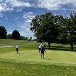 Panoramic view of a lush green golf course at Maxwelton Golf Club. Smooth