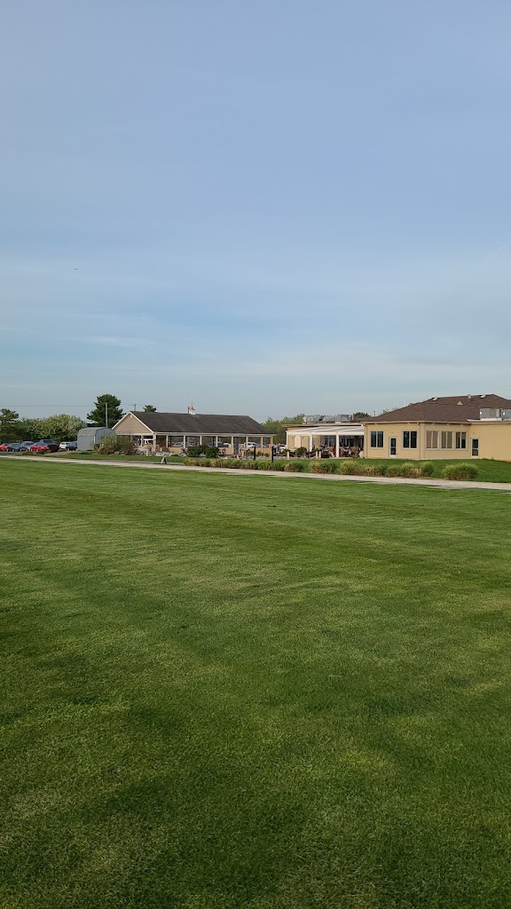 Panoramic view of a lush green golf course at Mayapple Golf. Smooth