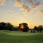 Panoramic view of a lush green golf course at McCabe Golf Course. Smooth
