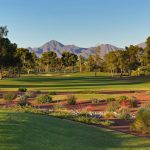 Panoramic view of a lush green golf course at McCormick Ranch Golf Club. Smooth