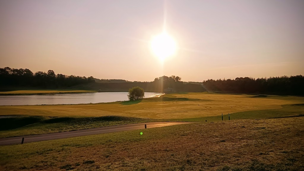 Panoramic view of a lush green golf course at McCullough's Emerald Golf Links. Smooth