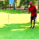 green grass with the flag in the hole.