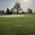 Panoramic view of a lush green golf course at McMillen Golf Course. Smooth