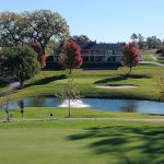 Panoramic view of a lush green golf course at McPherson Country Club. Smooth