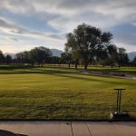 Panoramic view of a lush green golf course at Meadow Brook Golf Course. Smooth