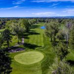 Panoramic view of a lush green golf course at Meadow Hills Golf Course. Smooth