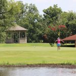 Panoramic view of a lush green golf course at Meadowbrook Country Club. Smooth