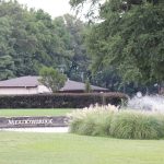 Panoramic view of a lush green golf course at Meadowbrook Country Club. Smooth