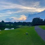 Panoramic view of a lush green golf course at Meadowbrook Country Club. Smooth