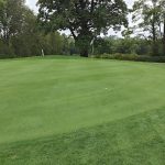Panoramic view of a lush green golf course at Meadowbrook Golf Course. Smooth