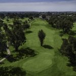 Panoramic view of a lush green golf course at Meadowlark Golf Club. Smooth