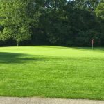 Panoramic view of a lush green golf course at Meadowlark Golf Course. Smooth