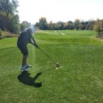 green grass with the flag in the hole.