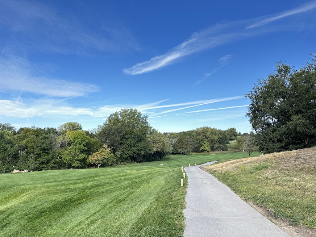 Panoramic view of a lush green golf course at Meadowlark Hills Golf Course. Smooth